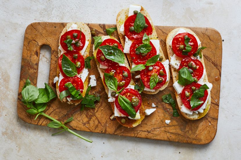 Baguette with feta, basil, tomatoes and capers