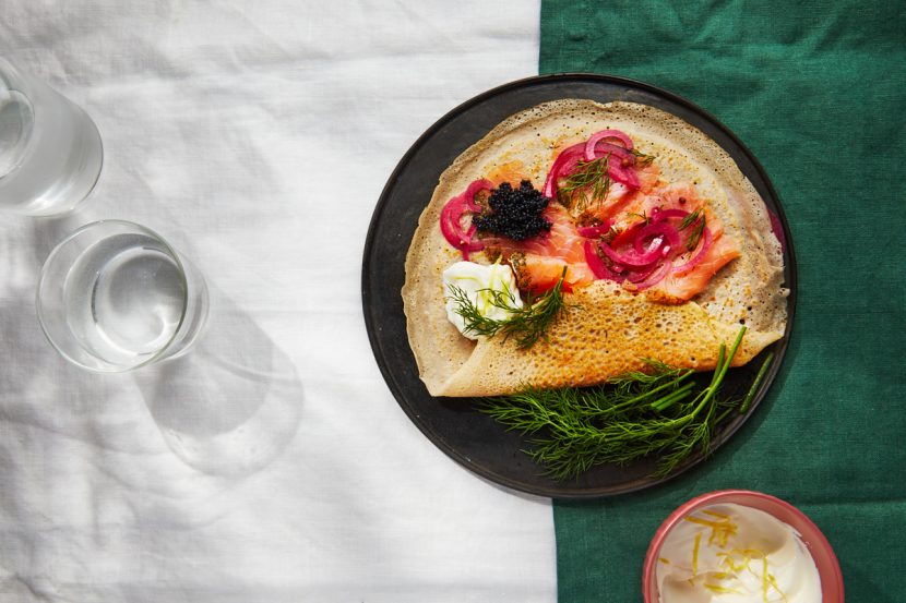 Buckwheat pancakes with pickled red onions, lemon sour cream, pinafore caviar and herbs